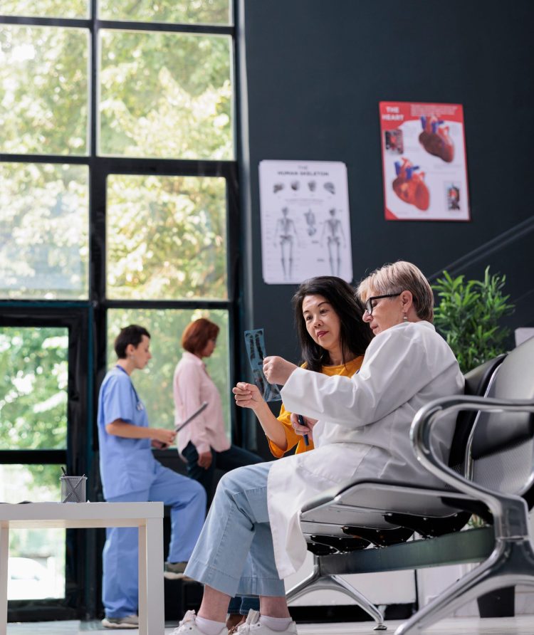 general-practitioner-and-asian-patient-analyzing-x-2025-02-19-07-24-58-utc